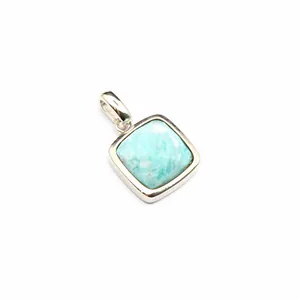 Macro detail of a minimalist square Amazonite stone pendant with a polished silver bezel.