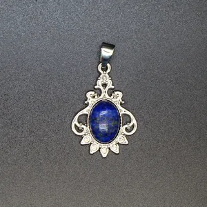 Close-up of vintage silver-tone pendant with oval blue lapis lazuli stone