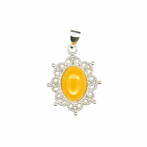 Detailed view of a yellow natural stone pendant with intricate silver filigree frame.