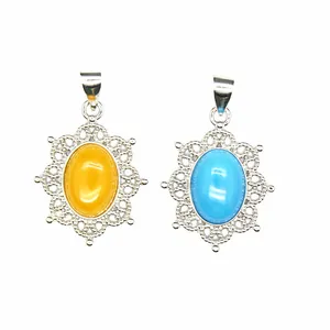 Detailed view of yellow and blue natural stone pendants with intricate silver filigree work.