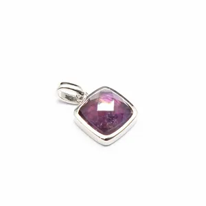 Detailed view of a square faceted purple natural stone pendant with silver metal bezel