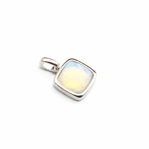 Detailed view of a small square cushion-cut natural stone pendant in silver bezel