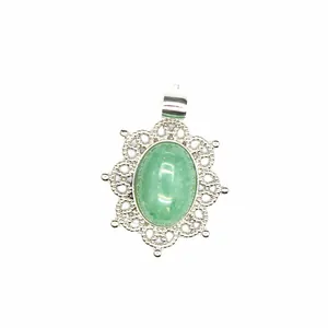 Vintage hollow silver-plated pendant featuring a smooth green oval natural stone