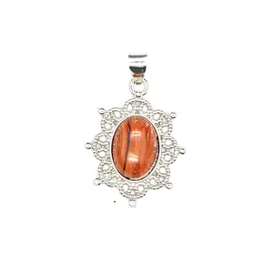 Detail view of a hollow silver pendant with a central oval striped natural stone.