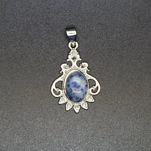Detailed view of a vintage-style silver pendant featuring a blue marbled natural stone.