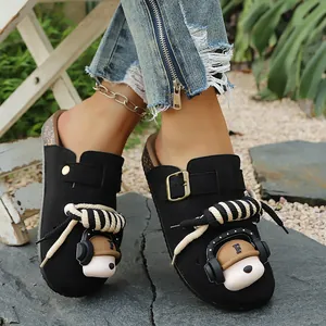 Black closed-toe clogs with cute headphone bear and decorative rope laces detail