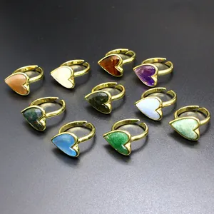 Macro view of vintage heart-shaped adjustable rings with various natural stones