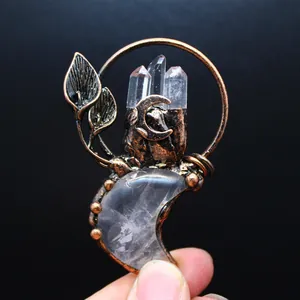 Close-up of vintage bronze pendant with natural crystal points and moon stone