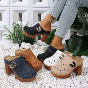 Detailed view of cutout platform mule shoes with metal buckles in multiple colors