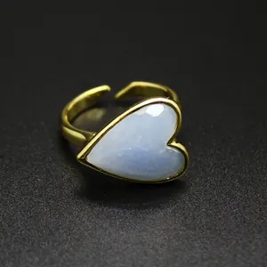 Close-up of a vintage heart ring with a blue gemstone in a gold finish setting