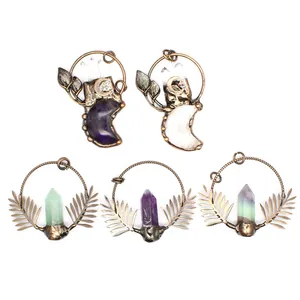 Five styles of vintage bronze pendants with natural crystals and leaf motifs.