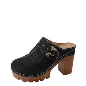 Retro black hollow-out platform mules with chunky heel and metal buckle detail