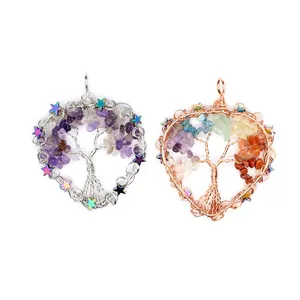 Detail of Tree of Life pendants with crystal chips in silver and rose gold finishes