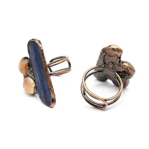 Close-up of irregular natural stone ring featuring blue kyanite and agate stones