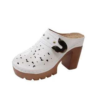 Elegant white hollow-out platform mules with gold buckle and chunky brown high heel
