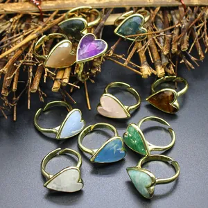 Vintage heart-shaped rings featuring colorful natural stones and a golden finish