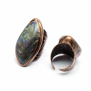 Detailed view of vintage natural stone ring featuring antique copper hammered adjustable band