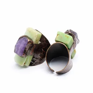 Detail of vintage adjustable ring with raw amethyst and rectangular chrysoprase stones