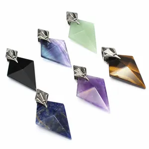 Detailed view of natural stone pendants with Poseidon trident metal bails.