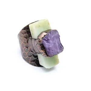 Close-up of vintage hammered copper ring with raw amethyst and green chrysoprase stone