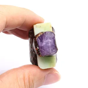 Close-up of vintage adjustable ring with natural Australian jade and raw amethyst