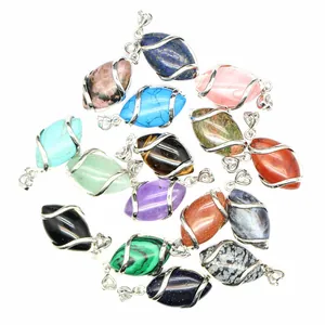 Close-up view of various natural stone marquise pendants with hollow wire wrap design