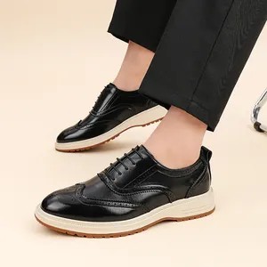 Black leather brogue shoes for men with thick off-white soles in a business style.