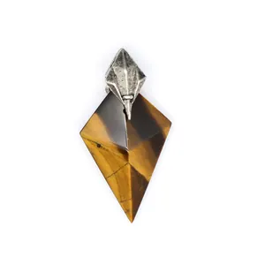 Detailed view of faceted tiger eye stone pendant with antique trident metal bail