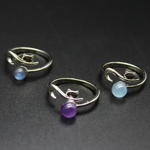 Detail view of fox-shaped open rings with amethyst, aquamarine and labradorite stones