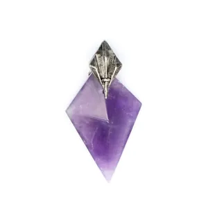 Detail of a purple amethyst pendant with a silver-colored Poseidon trident bale.