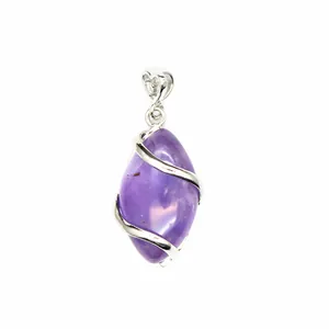 Macro shot of a purple marquise amethyst pendant with elegant silver wire wrap design.