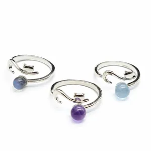 Detailed view of three fox-shaped open rings featuring different natural gemstone beads.