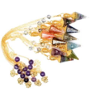 Macro view of assorted resin hexagonal cone pendulums with natural crystal stones and gold chains