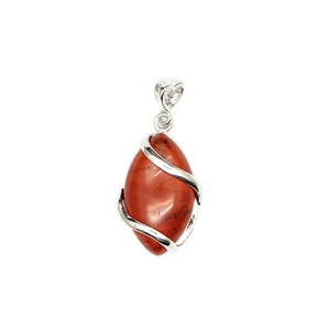 Detailed view of red marquise natural stone pendant with silver heart bail