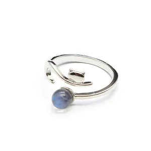 Detailed close-up view of silver fox shaped open ring with a round blue natural stone