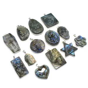 Detailed view of assorted natural labradorite pendants with intricate hand carvings