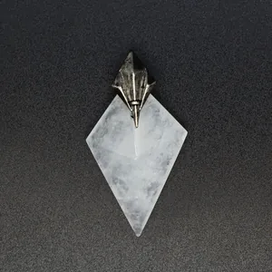 Detailed view of the diamond-shaped white natural stone pendant with metal top