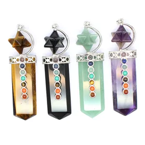 Detail view of 7 chakra Merkaba star crystal sword pendants in various gemstones