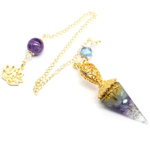 Detailed macro view of amethyst resin hex cone pendulum with gold chain