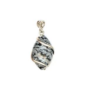 Detailed view of a snowflake obsidian marquise pendant with a silver heart bail