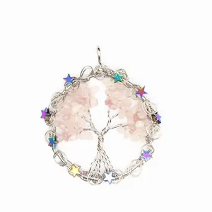 Detailed view of handmade wire wrapped tree of life pendant with rose quartz and stars