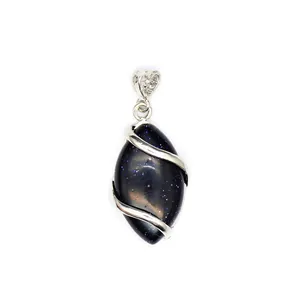 Macro view of blue goldstone marquise pendant featuring silver-tone metal swirl wrap detail