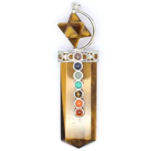 Macro detail of tiger's eye 7 chakra stones Merkaba sword shaped healing crystal pendant