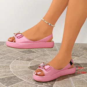 Side view of stylish pink platform sandals with 3cm low heel and bow knot detail
