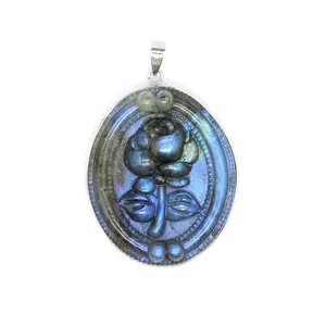 Detailed view of a natural labradorite pendant with a finely carved rose motif.