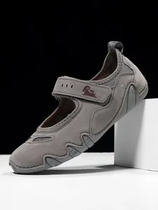 Side view of grey Mary Jane sports shoes with velcro strap and ram logo
