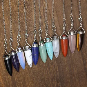 Macro view of natural stone bullet pendulum pendants in various colors and textures