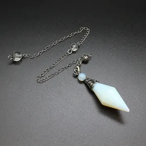 Detailed close-up of a hexagonal bipyramid opalite crystal dowsing pendulum with chain