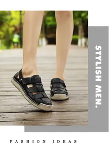Close-up detail of men's black leather sandals with durable rubber soles outdoors