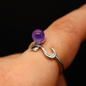 Elegant open silver fox ring featuring a natural purple amethyst stone on a finger.